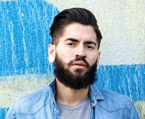 modern-man-standing-outdoors-alone-PHCKVDN-300x246